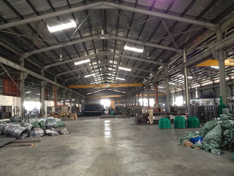 The KCSS factory floor with wire coils and overhead cranes