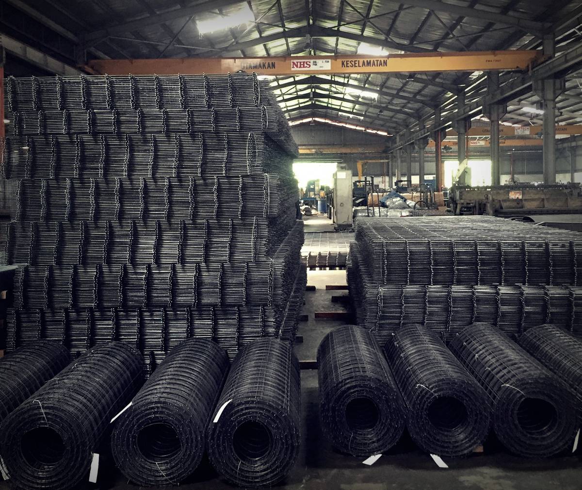 Welded mesh panels and rolls stacked inside the KCSS factory