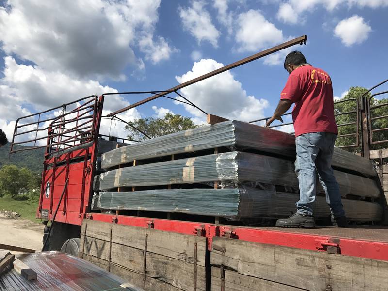 Mesh panels being loaded onto a lorry for delivery